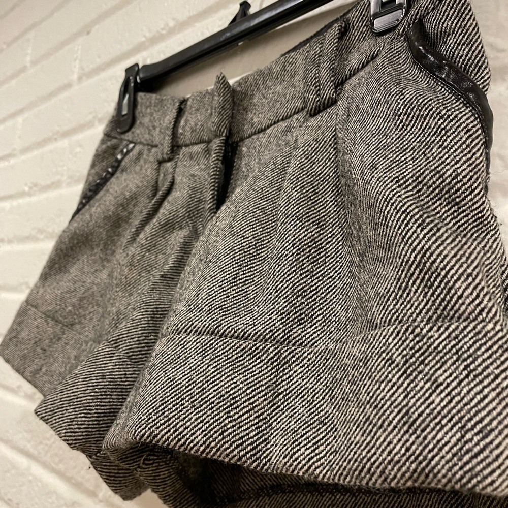 Winter weather “tweed” shorts. Cuffed bottoms and faux leather details.